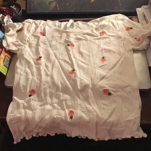 Cropped blouse with sweet detail; can suit girl or petite woman